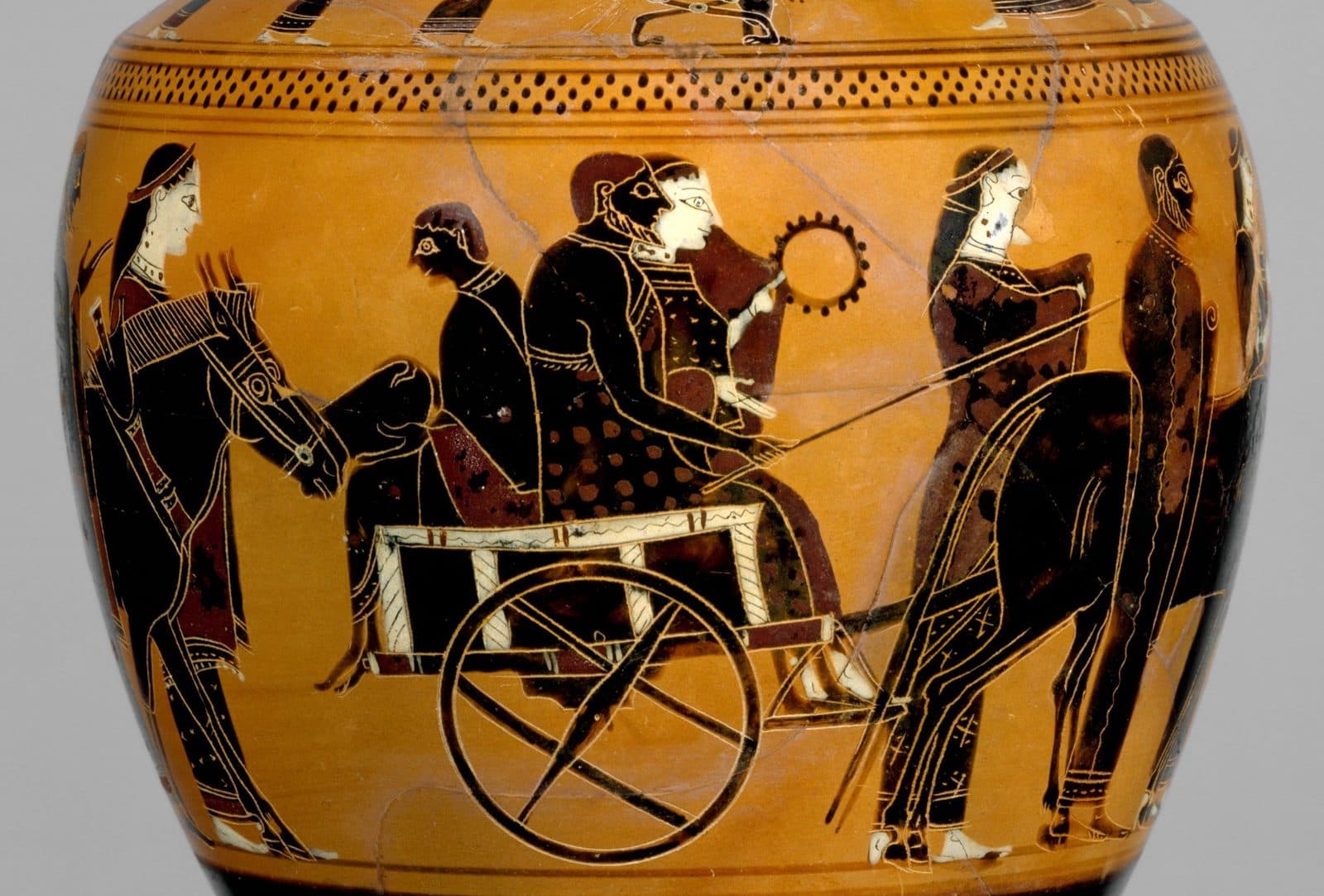 Black-figure vase painting of a wedding procession: a bride and groom seated in a mule cart with a companion beside them, and wedding guests walking alongside