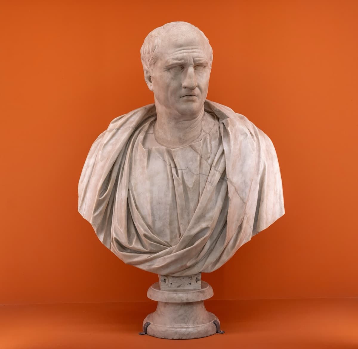Marble portrait bust of Cicero, an older man with a lined face and receding hair, wearing a toga