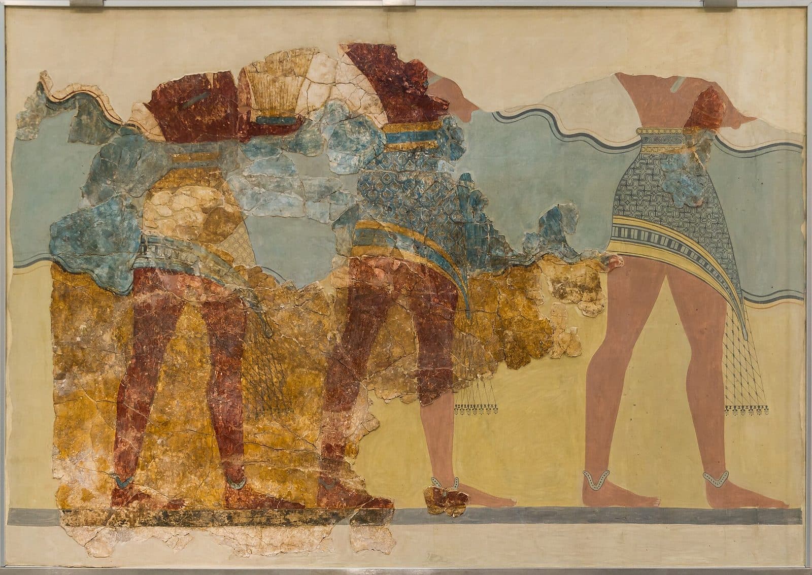 Fragmentary Minoan wall painting of three male figures walking in procession, shown from the waist down in patterned kilts with bare red-brown legs, against blue and yellow bands